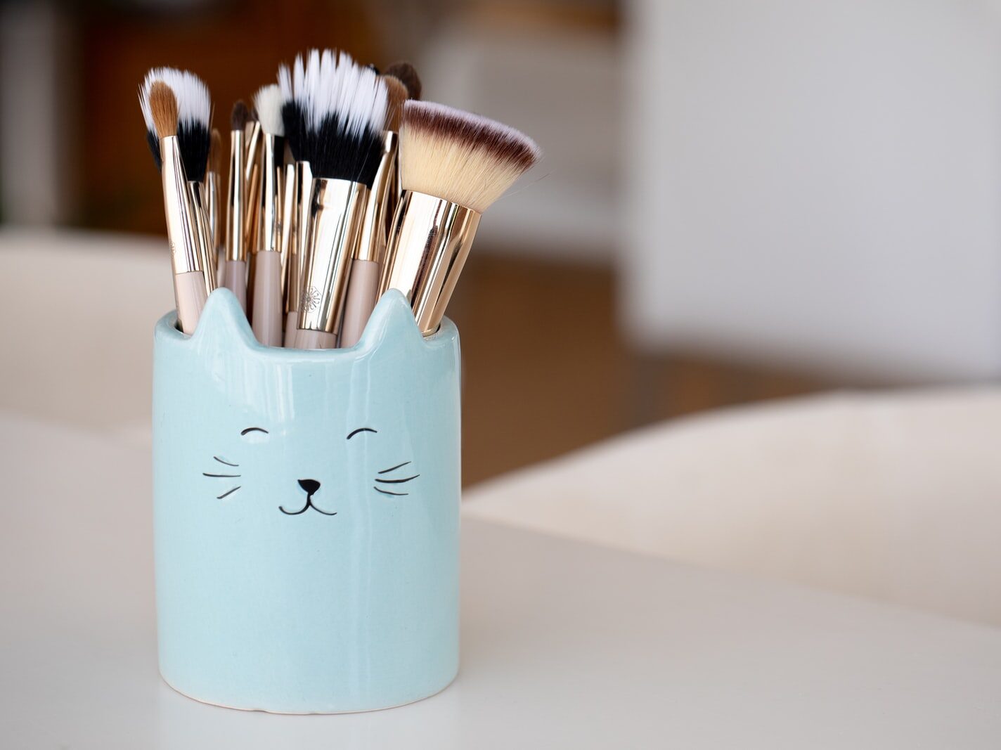 white ceramic mug with brush