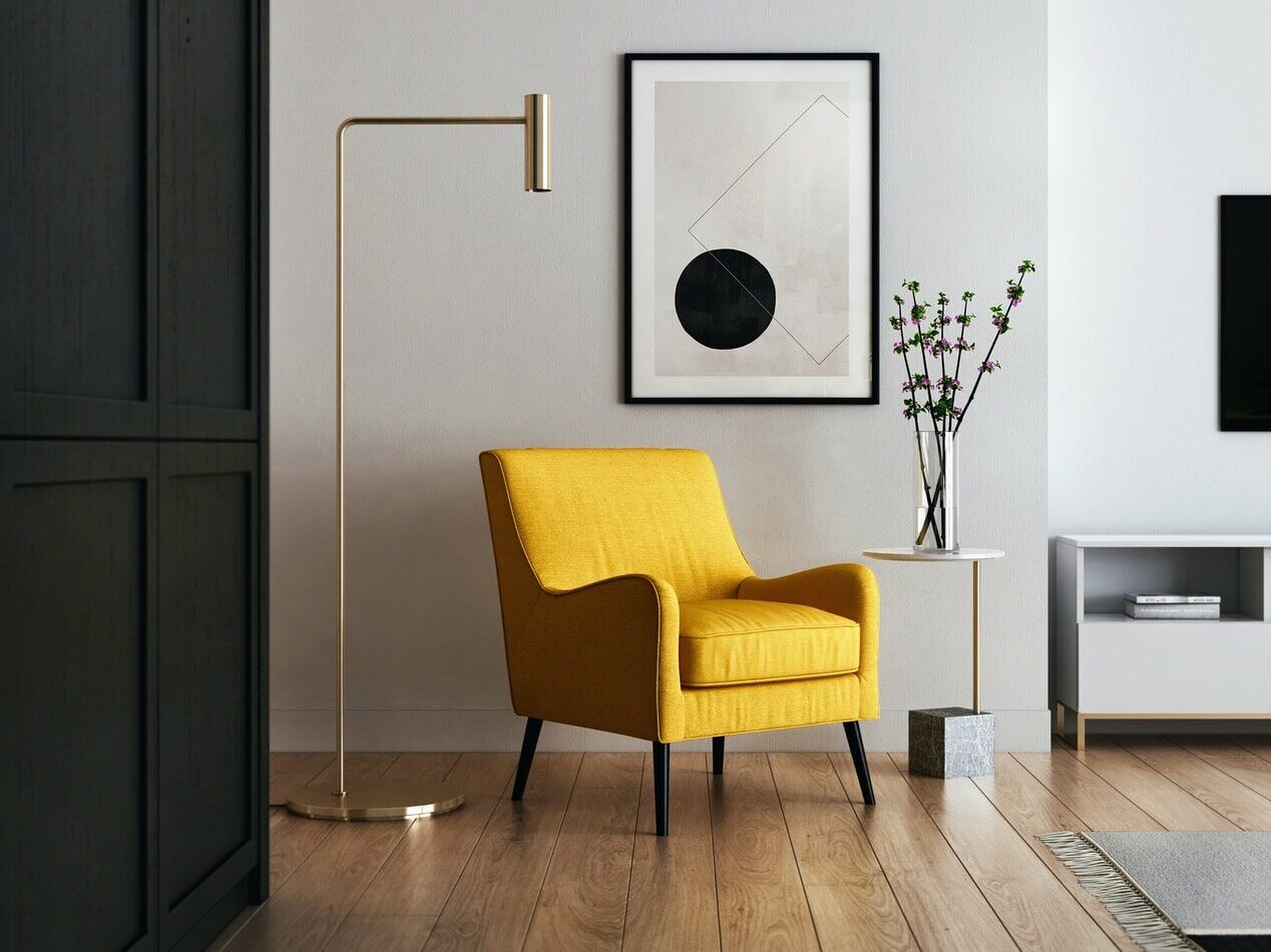 brown wooden framed yellow padded chair