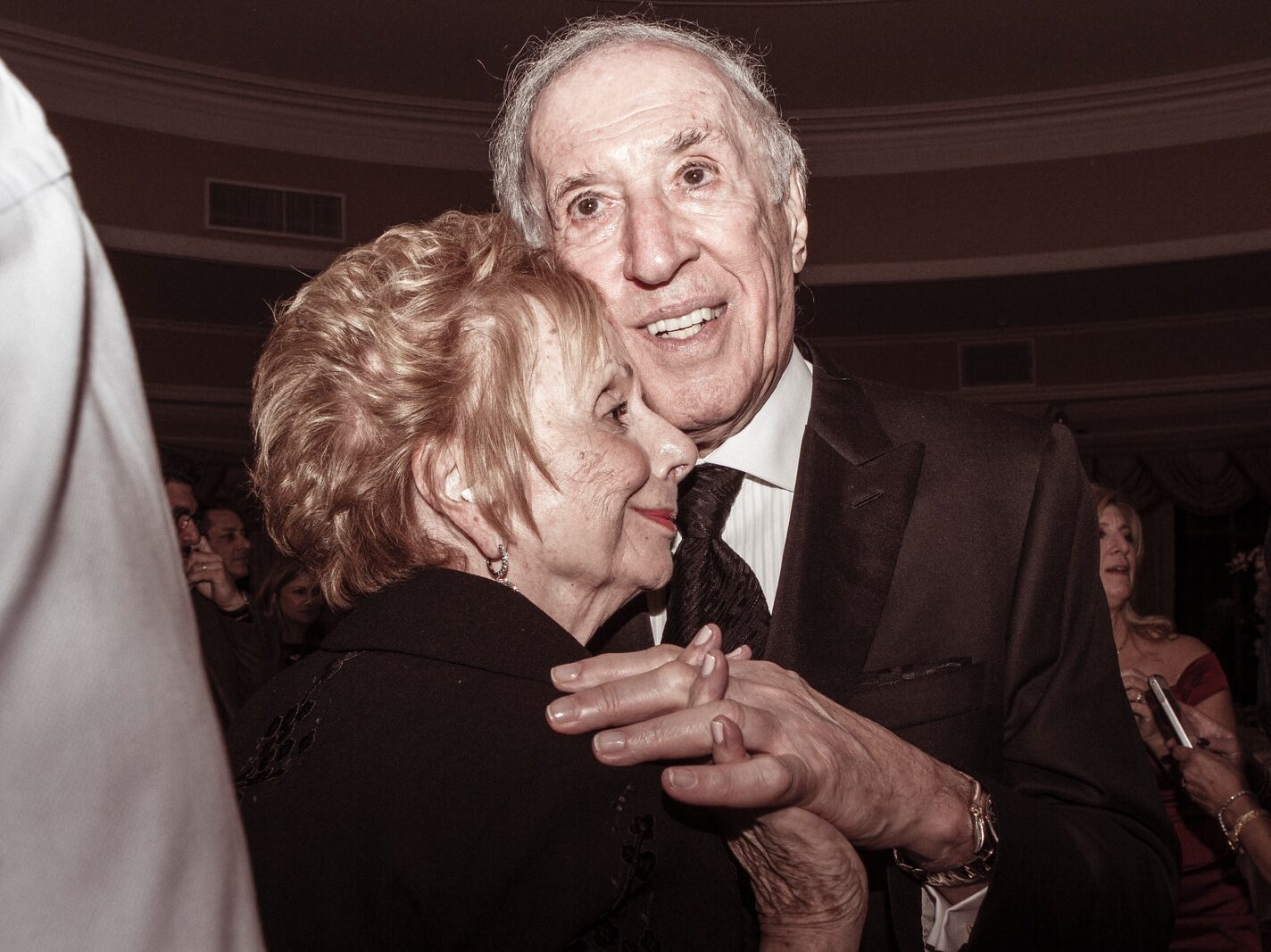 man and woman in formal suit dancing