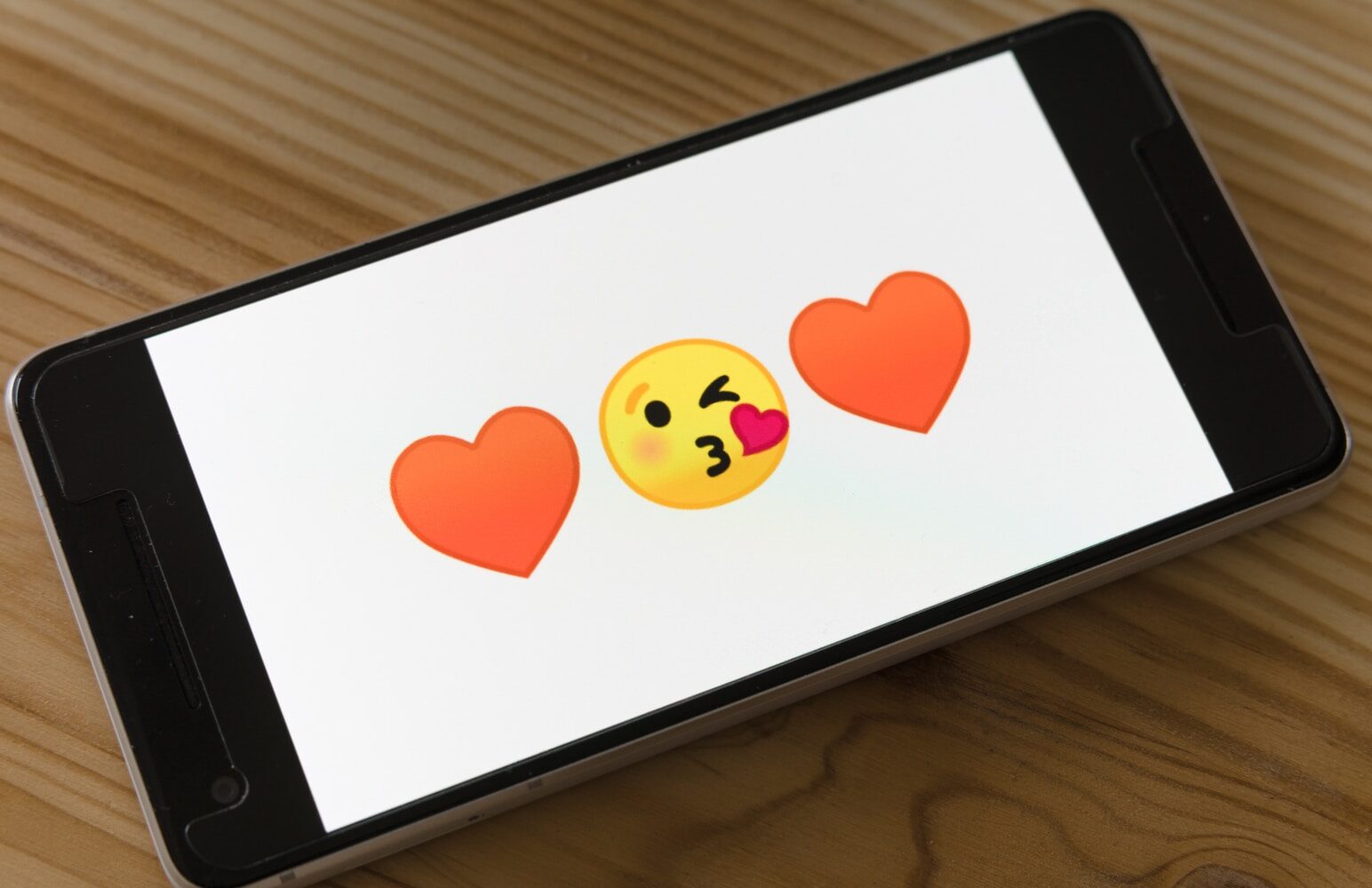 black ipad on brown wooden table