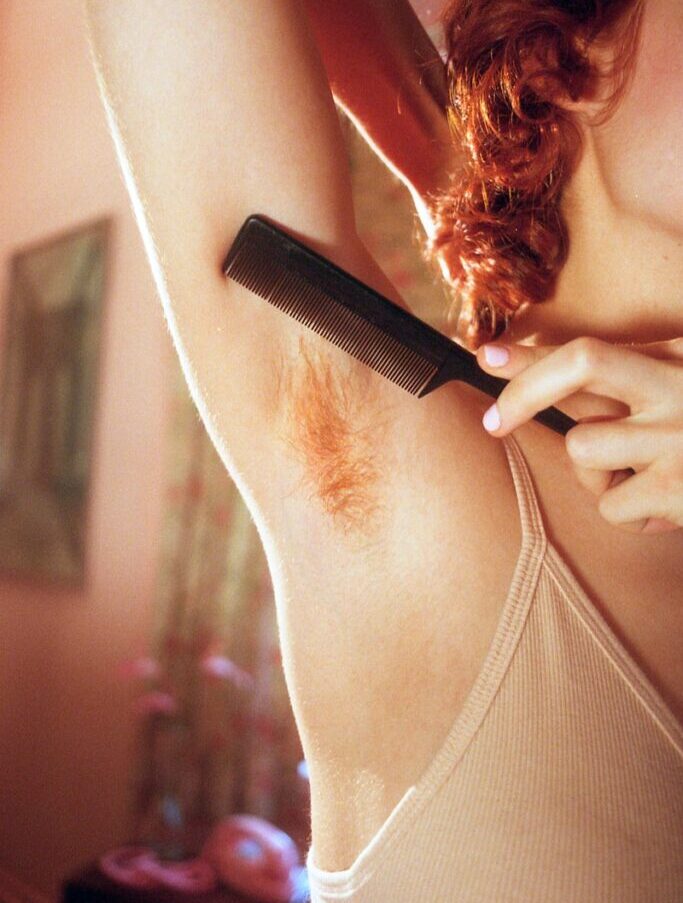 person holding hair comb