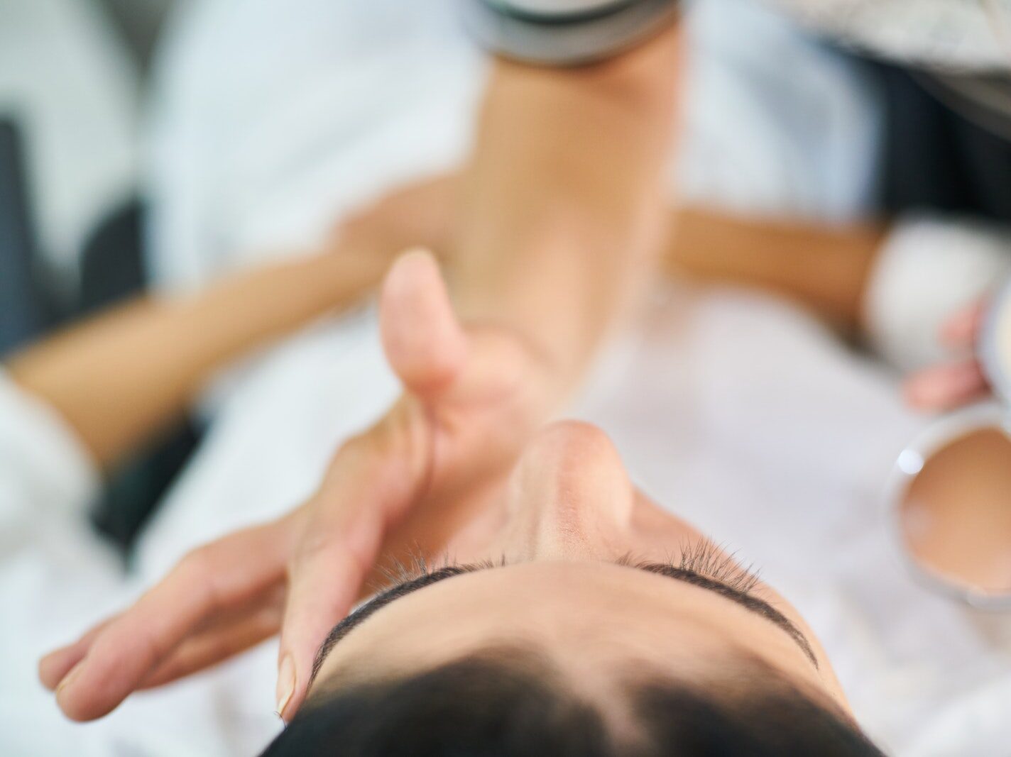 Person Touching Woman's Face
