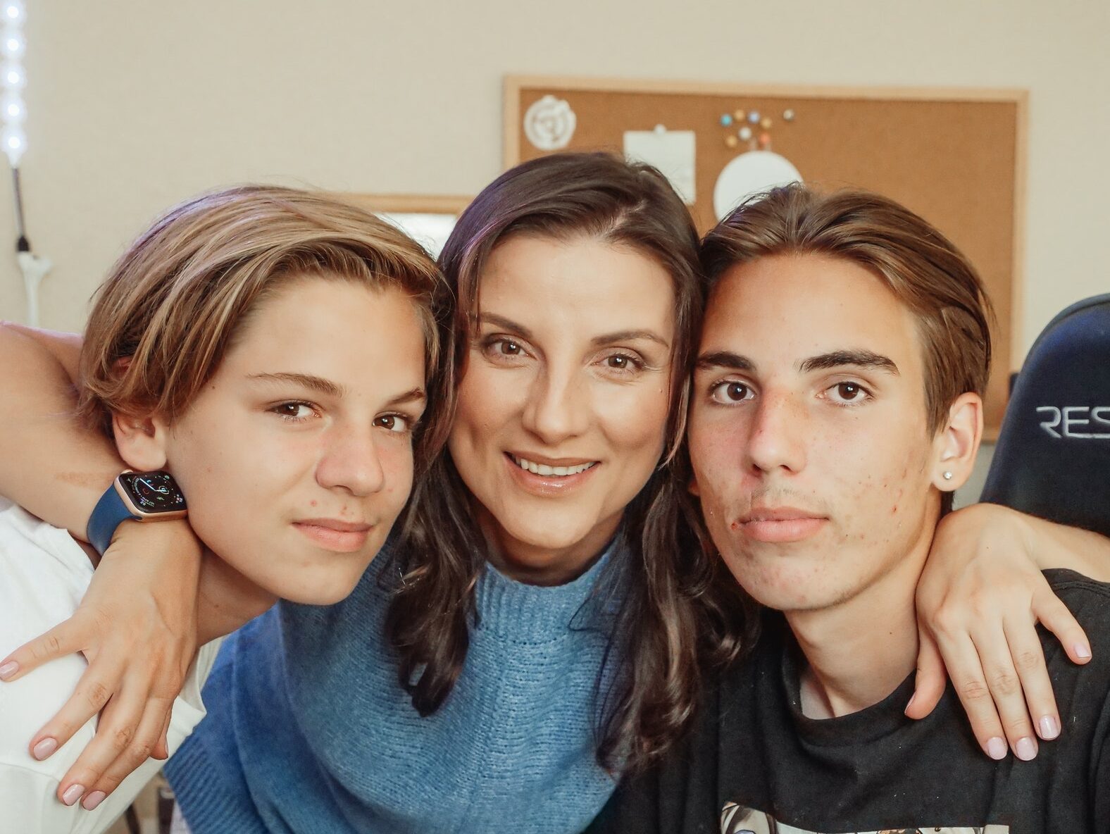 Woman in Blue Sweater Beside Woman in Black Crew Neck Shirt