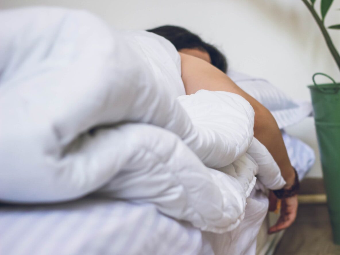 woman in white robe sitting on chair