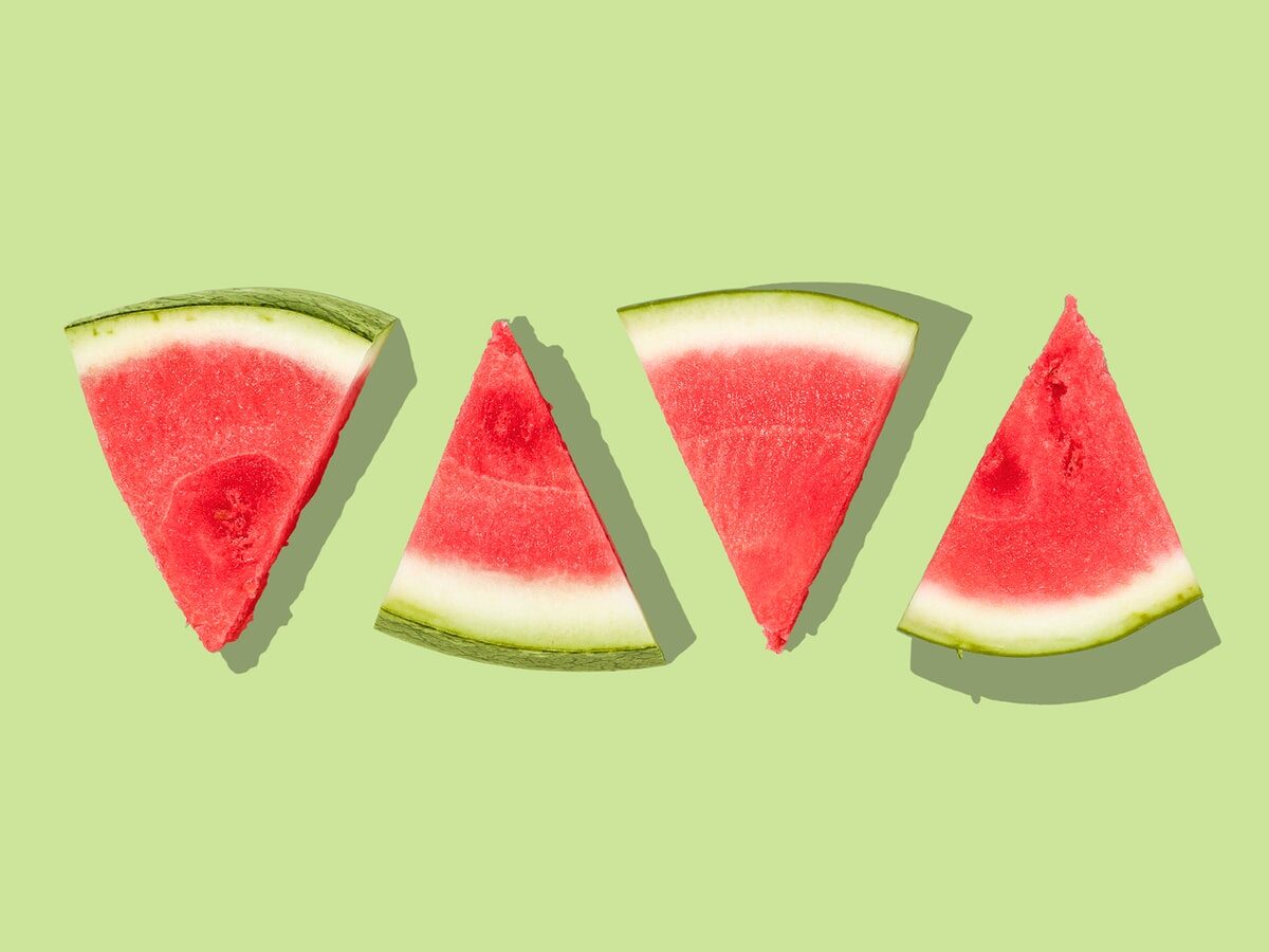 sliced watermelon with green background
