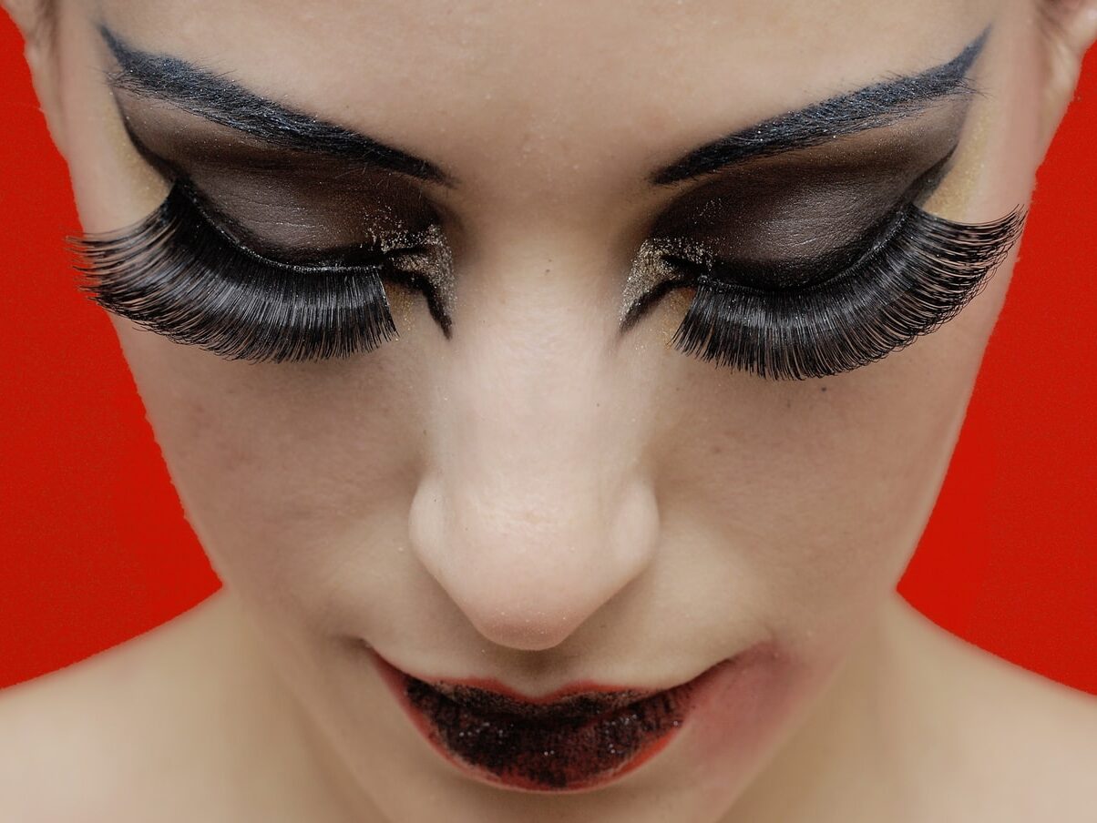 woman with black lipstick and red lipstick