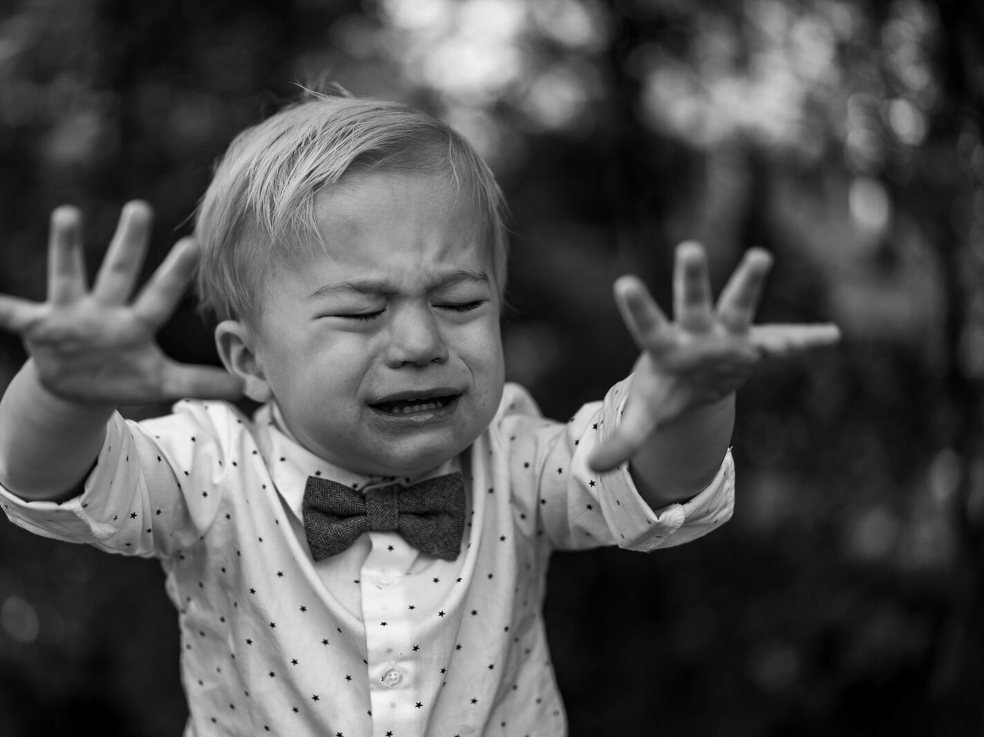 grayscale photo of girl in polka dot long sleeve shirt