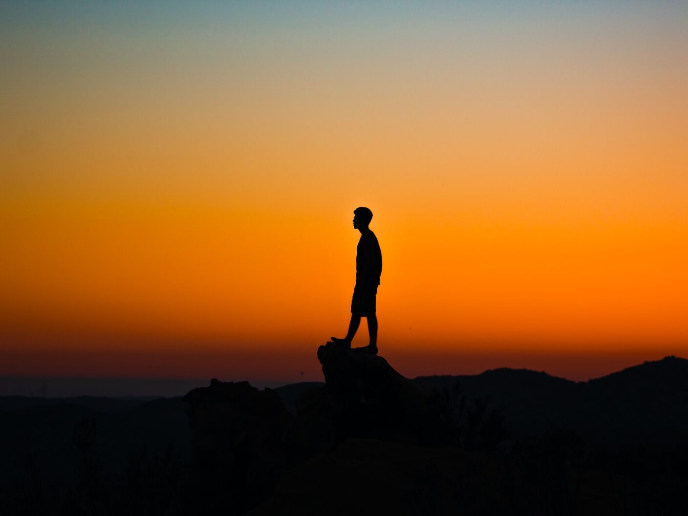 silhouette of man during sunset