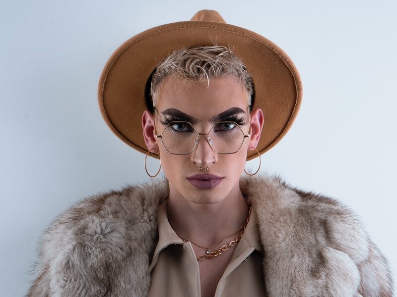 woman in brown fur coat wearing brown hat