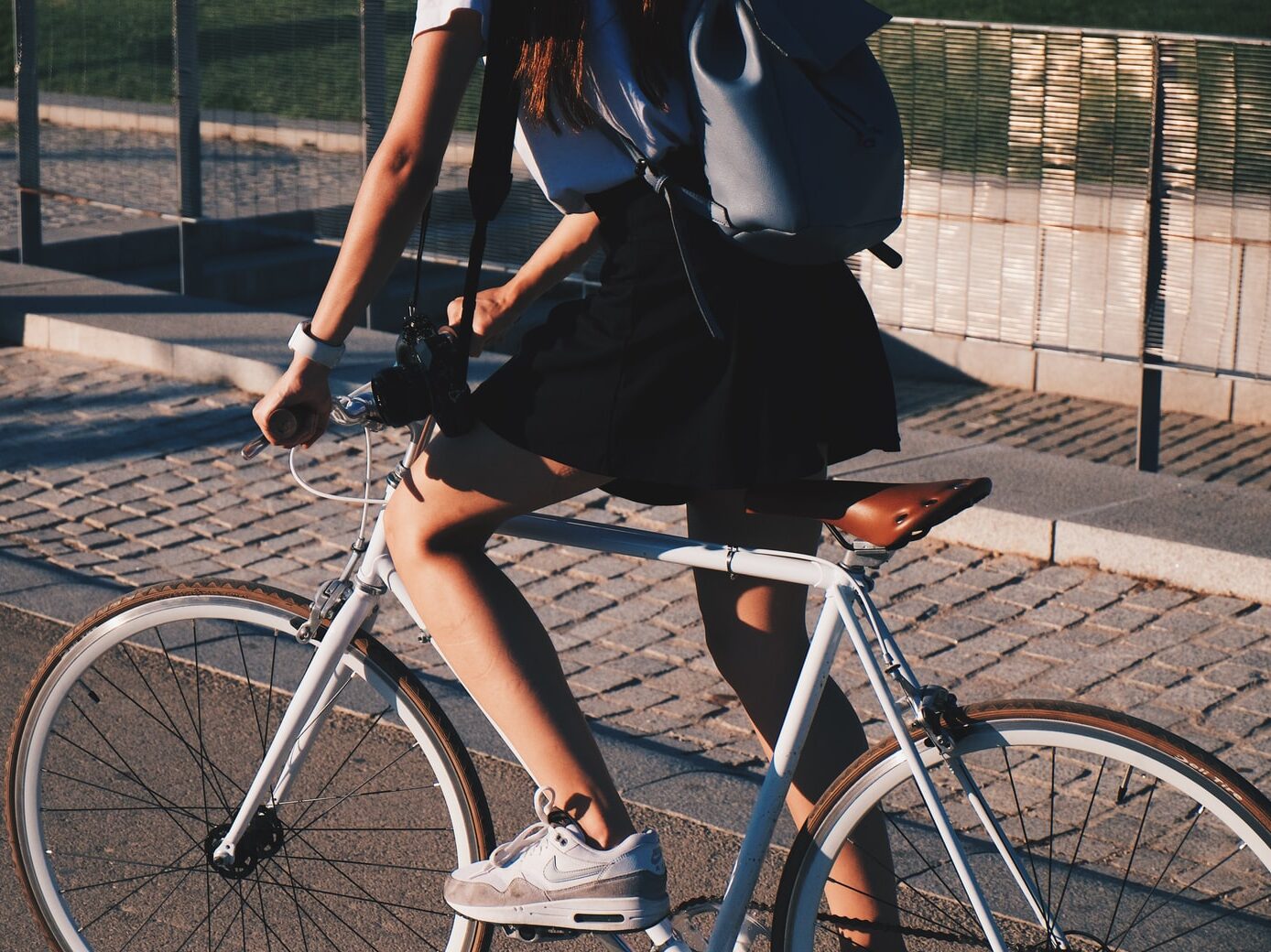 woman riding white rigid bike