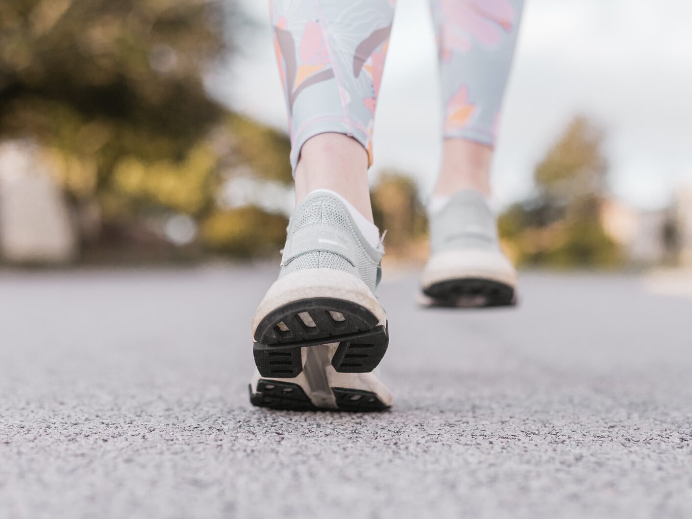 person in white and black nike shoes