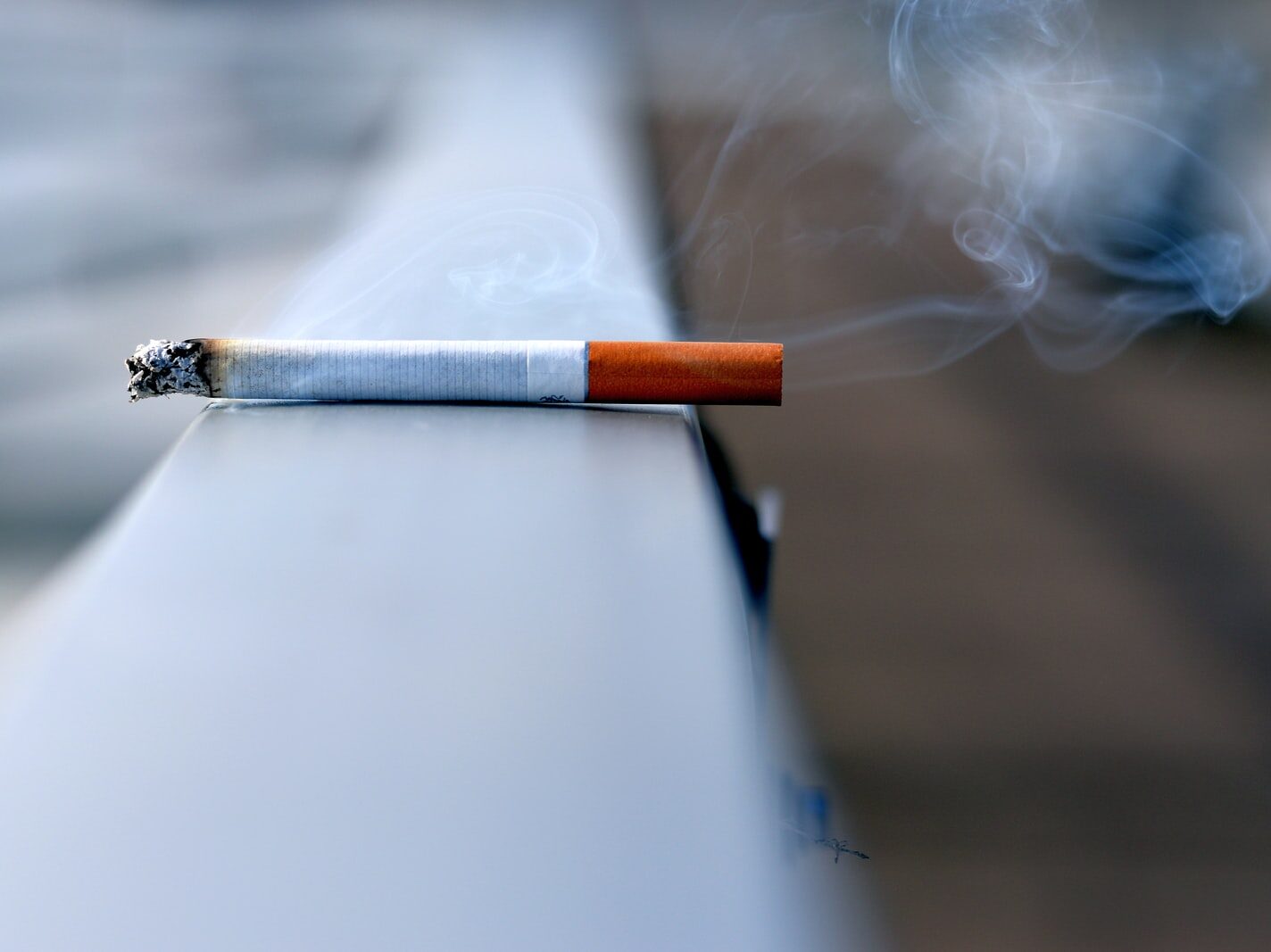 white cigarette stick on white wall