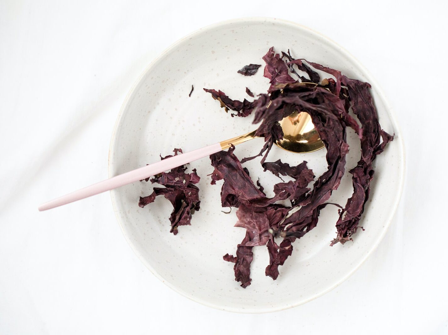 white ceramic plate with brown wooden chopsticks