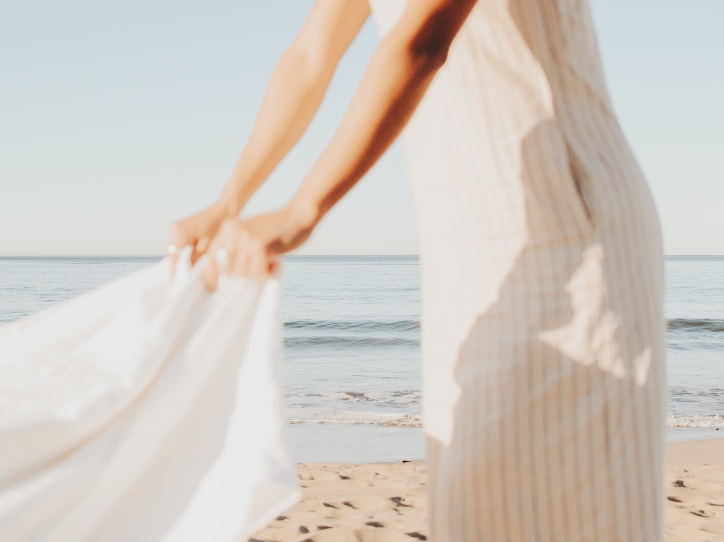 person wearing white dress during daytime