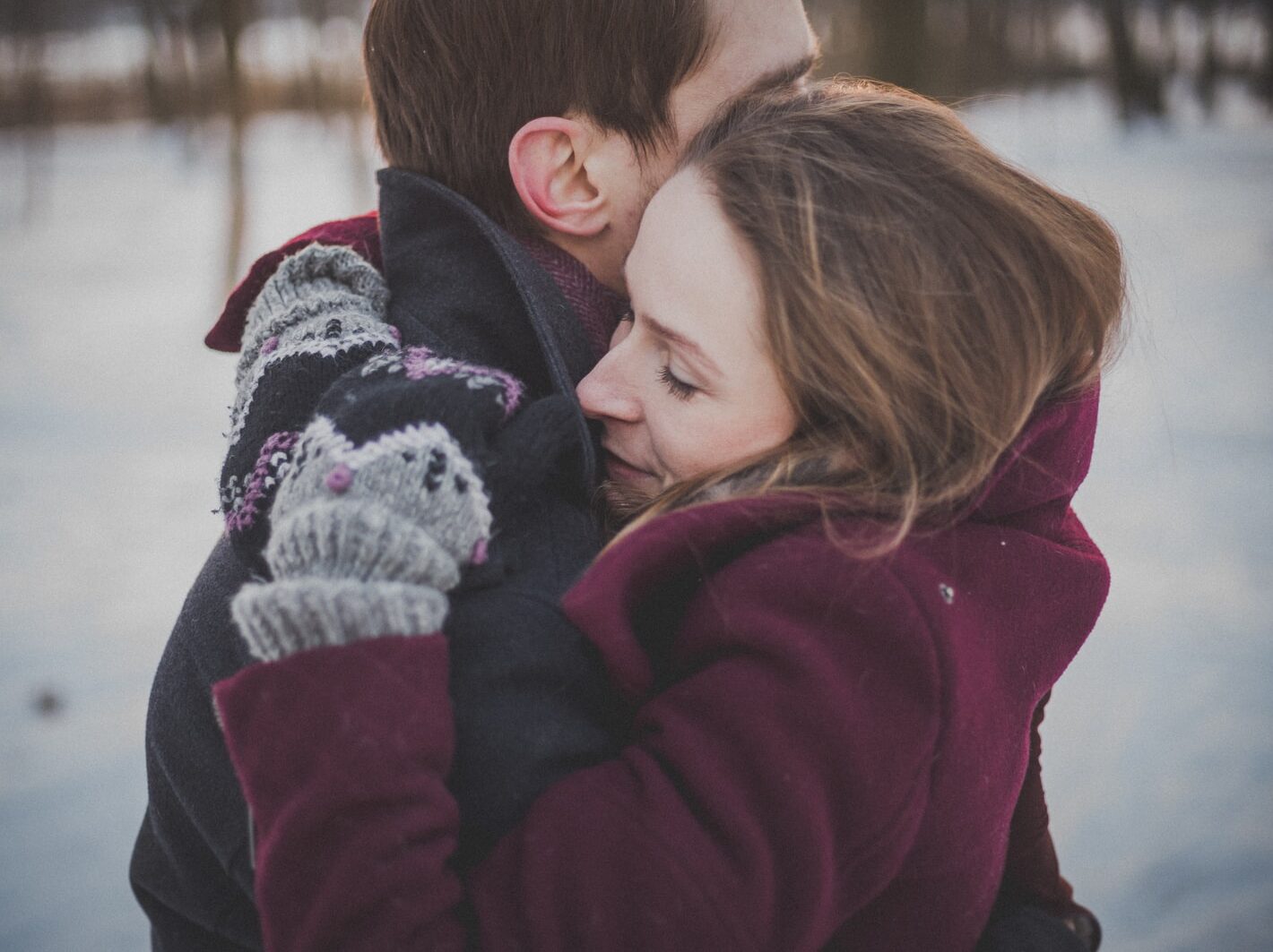 man and woman hugging each other
