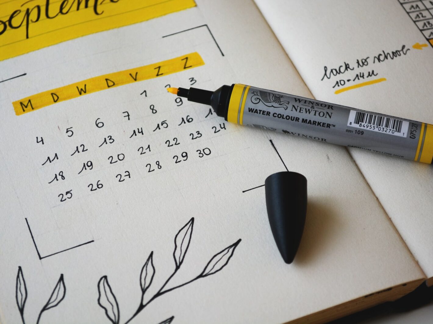 black marker on notebook