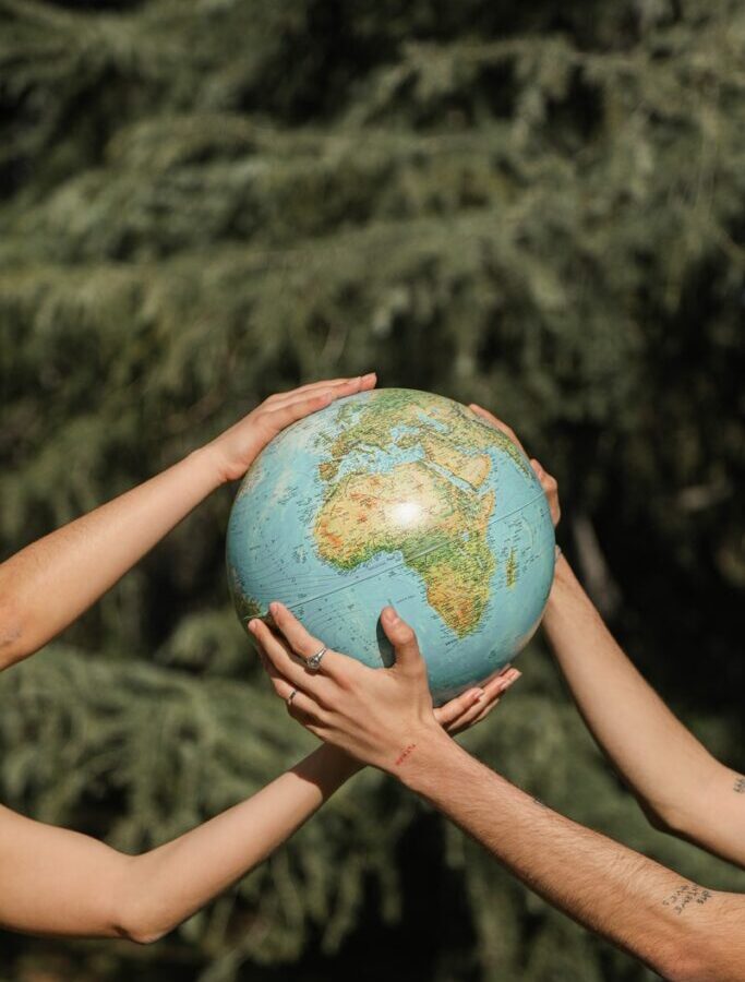 People Holding a Globe