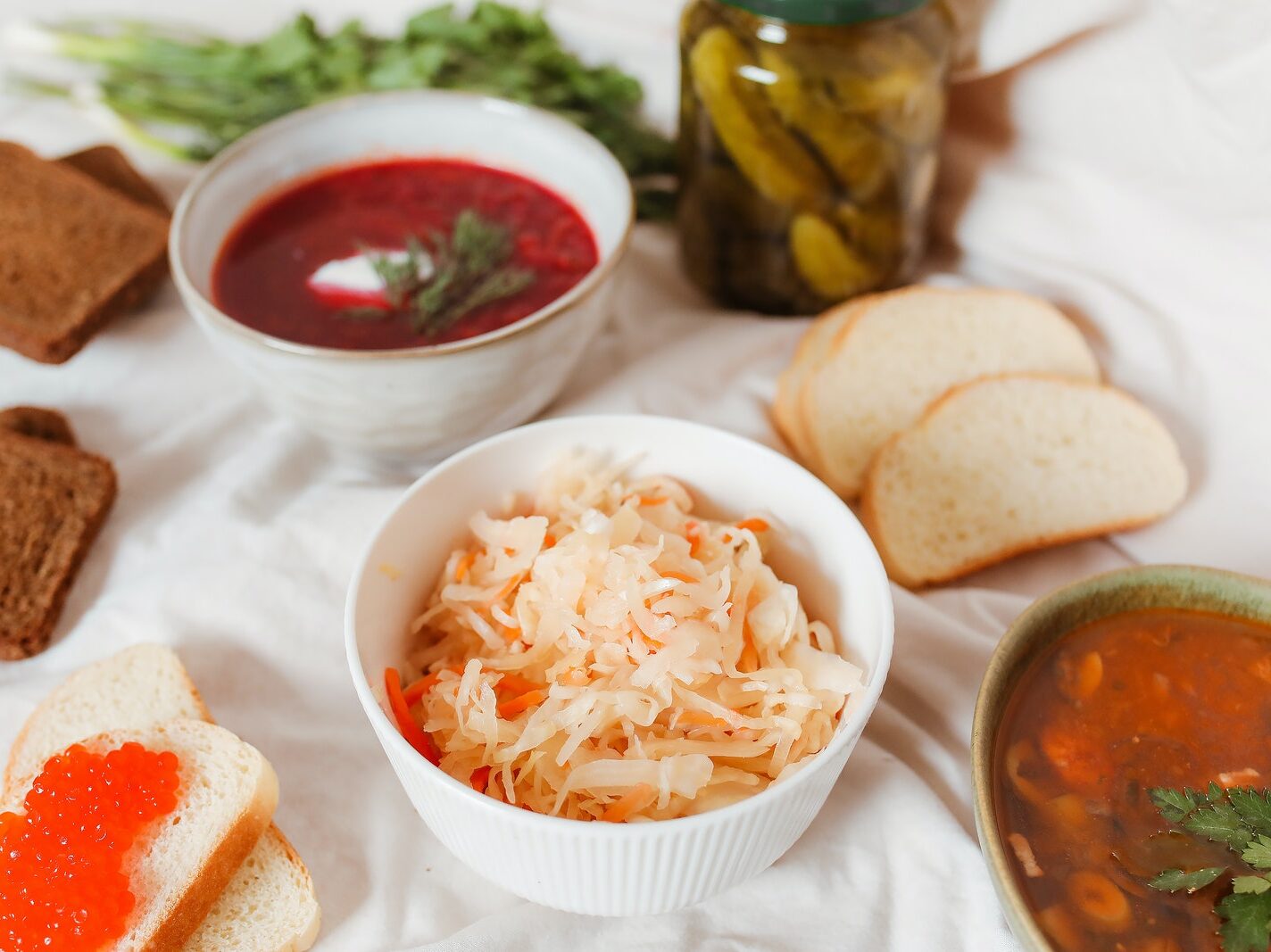 A Delicious Bowls of Food with Slices of Breads and Salmon Roe