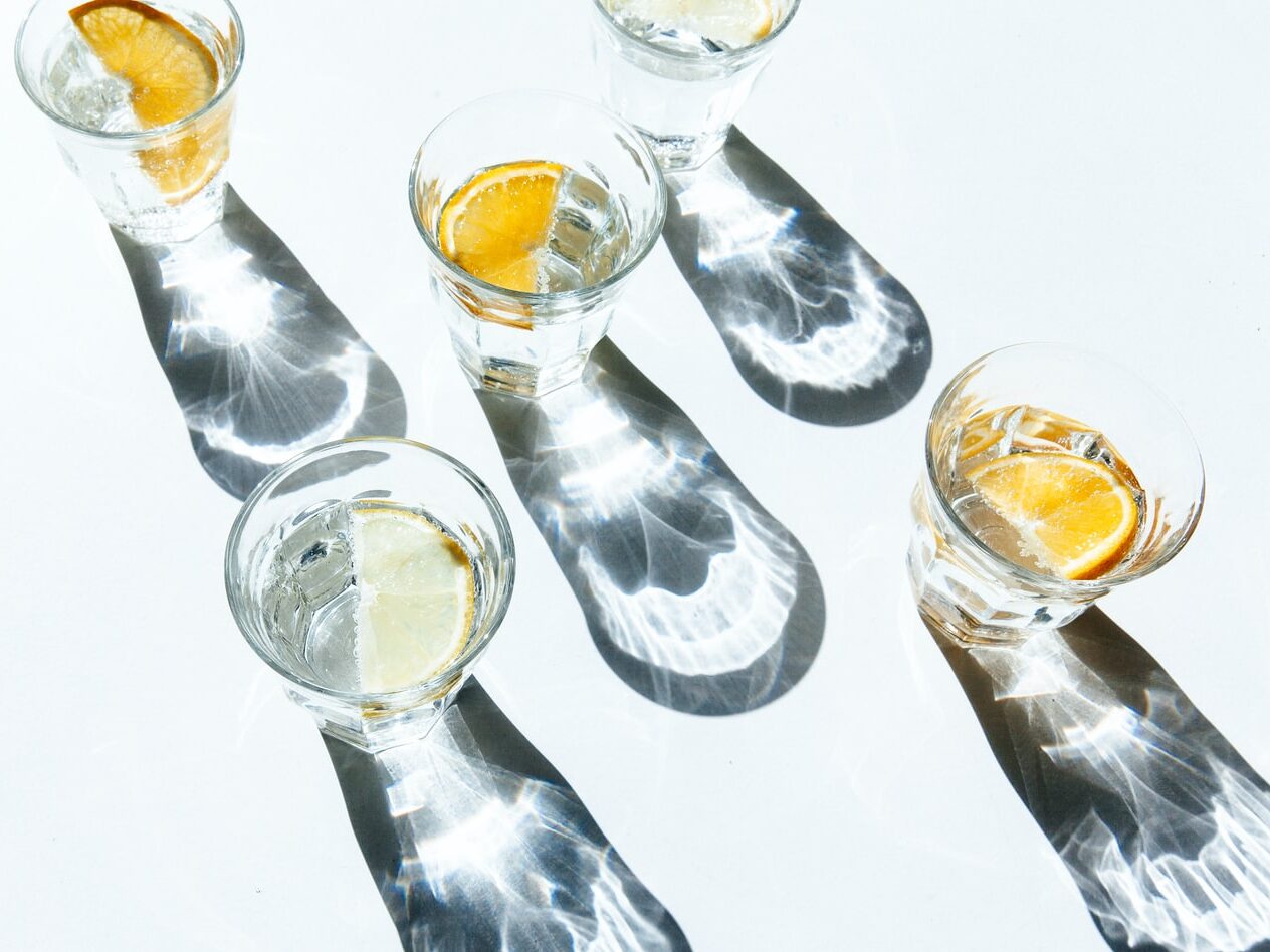 five clear shot glasses