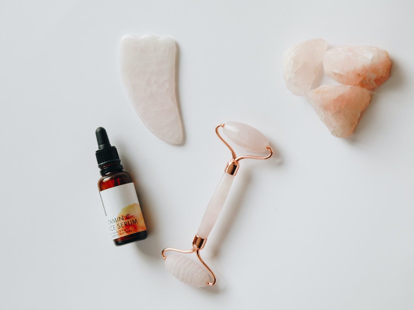 white and black plastic bottle beside white heart shaped ornament