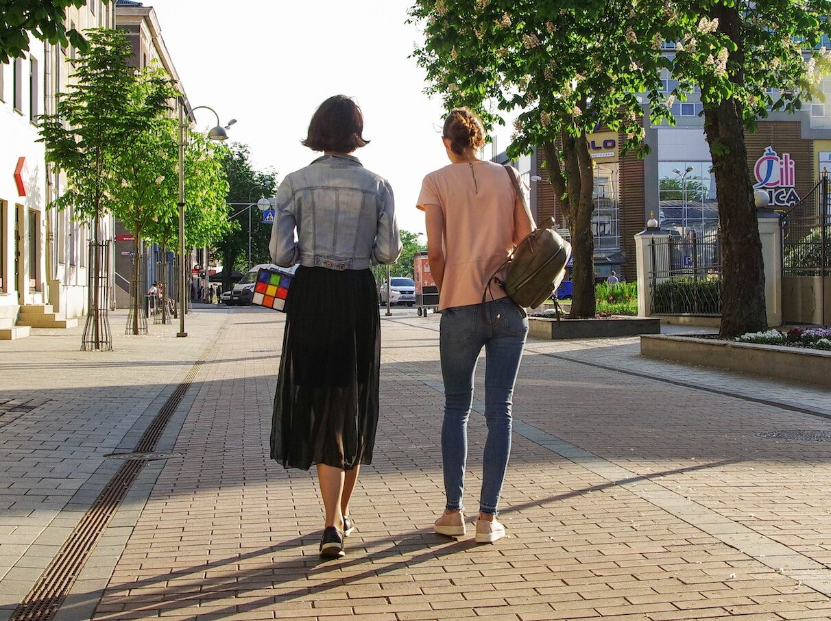 Photo of Women Walking Down the Street
