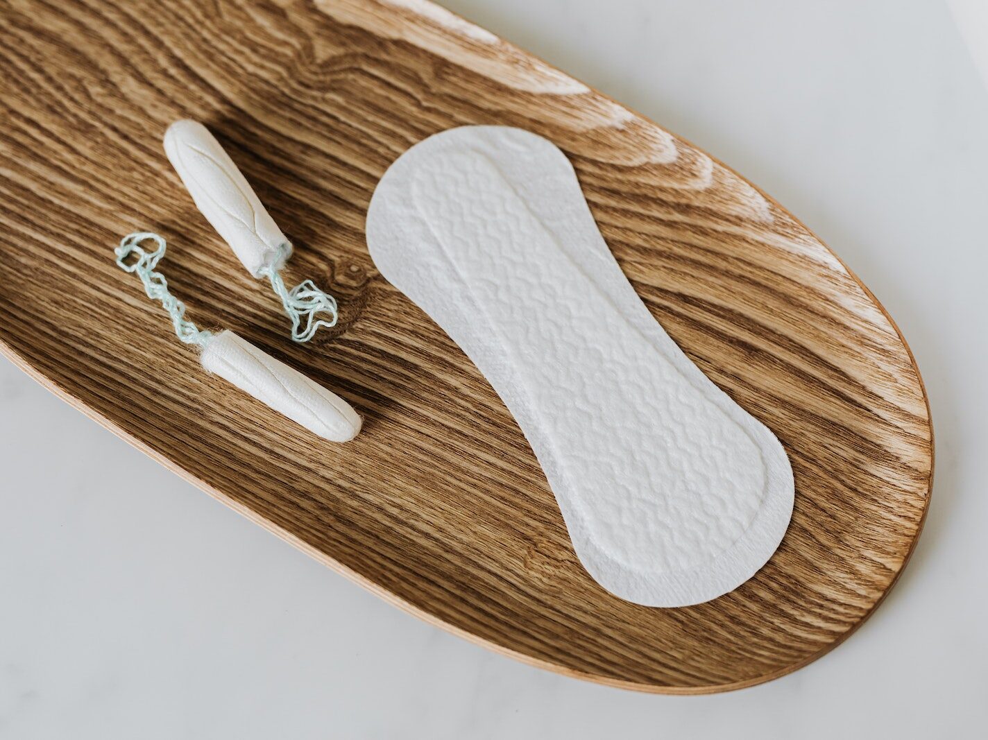 Products of personal hygiene for women on wooden stand