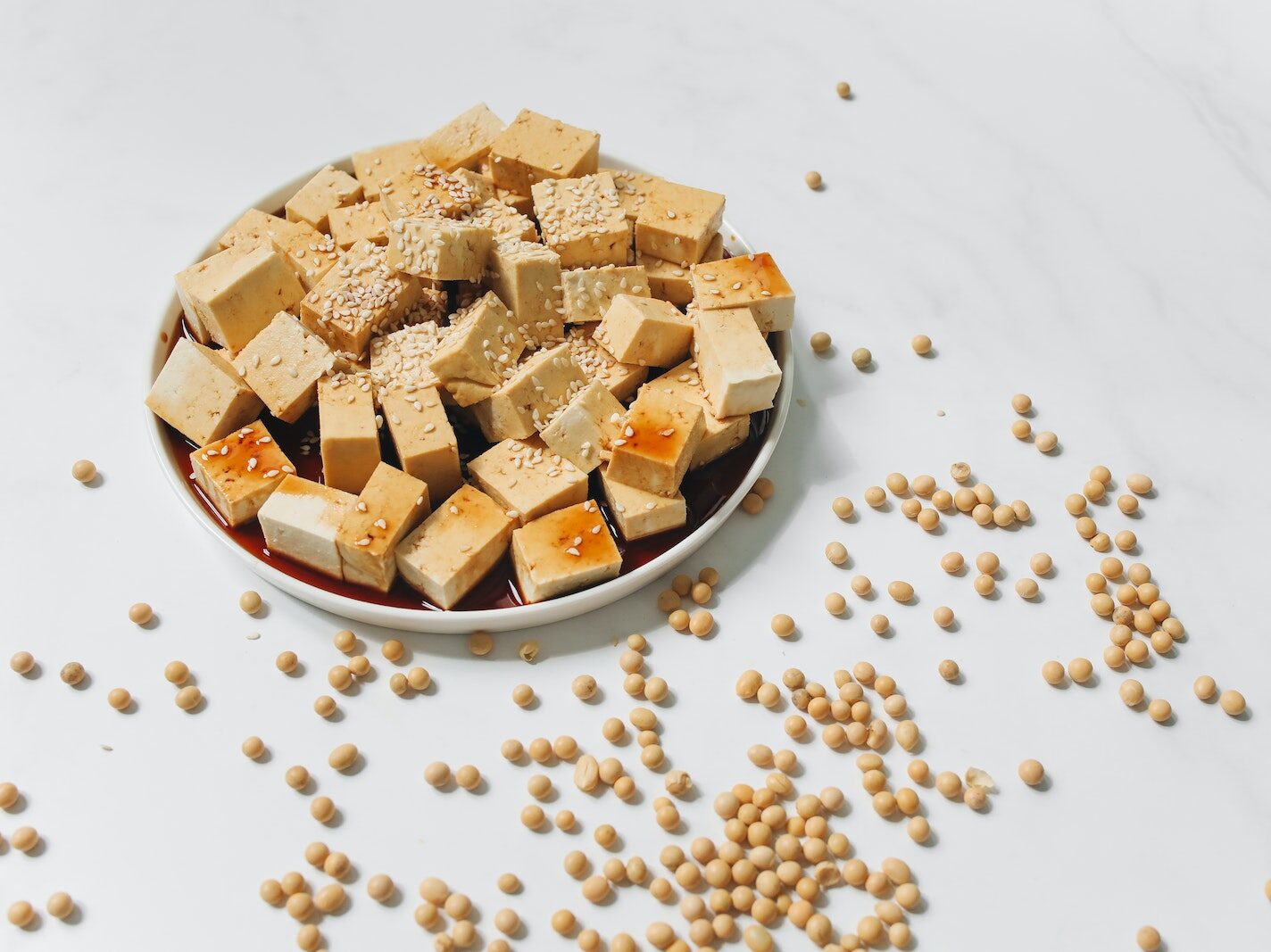 Sliced Tofu with Sesame Seeds on White Plate