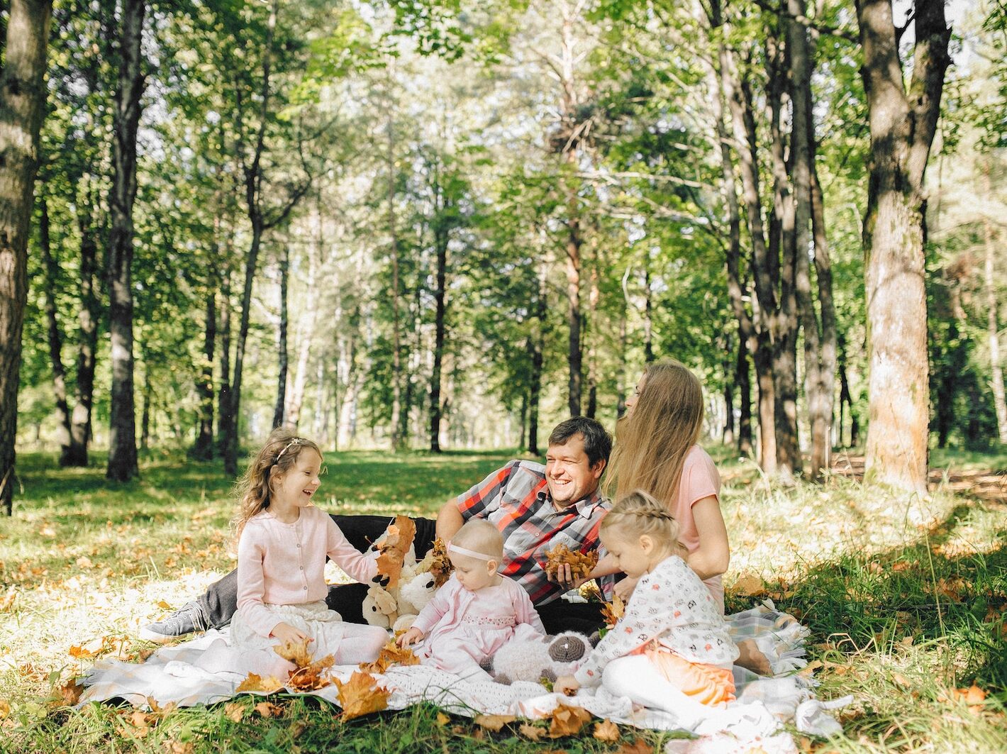 Happy Family on a Picnic Blanket