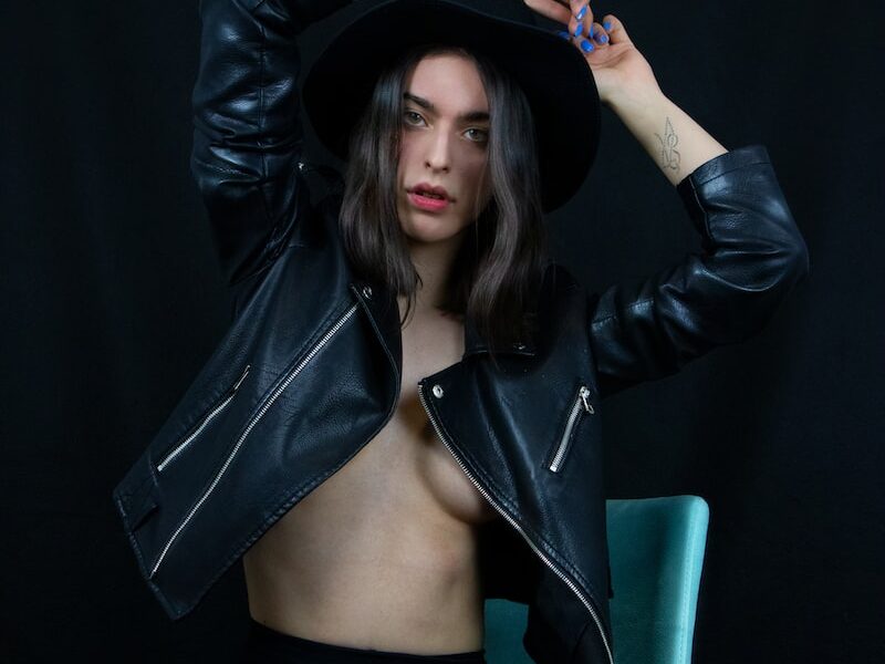 woman in black leather jacket and black skirt