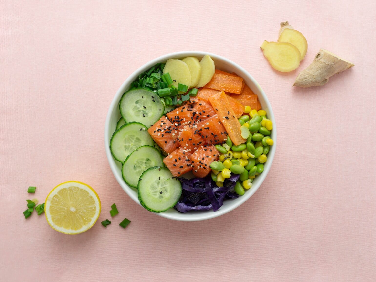 sliced cucumber and sliced lemon on white ceramic bowl