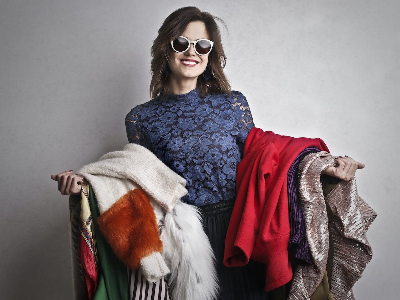 Woman Holding Different Kid Of Coat