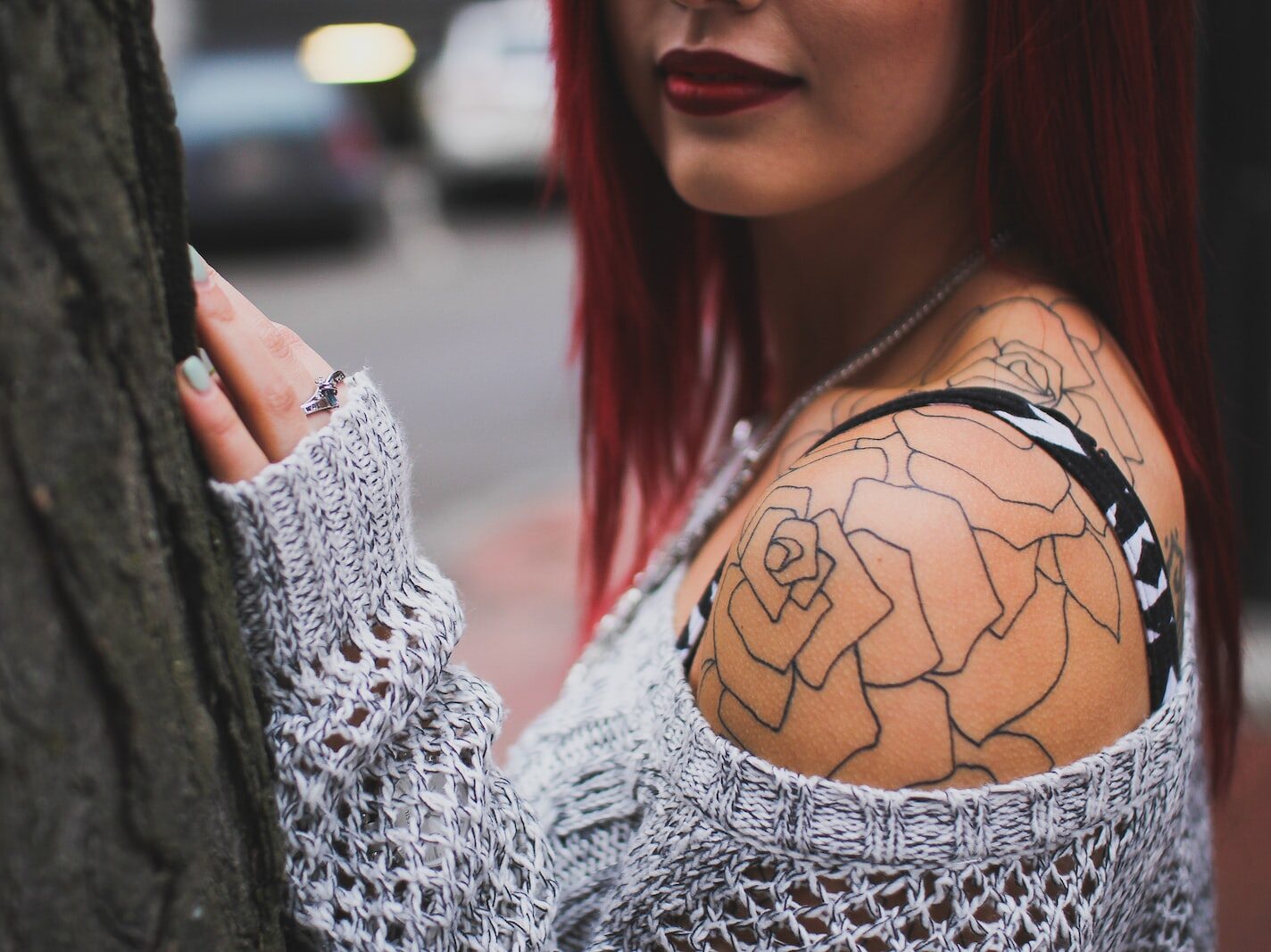 woman holding while standing on tree