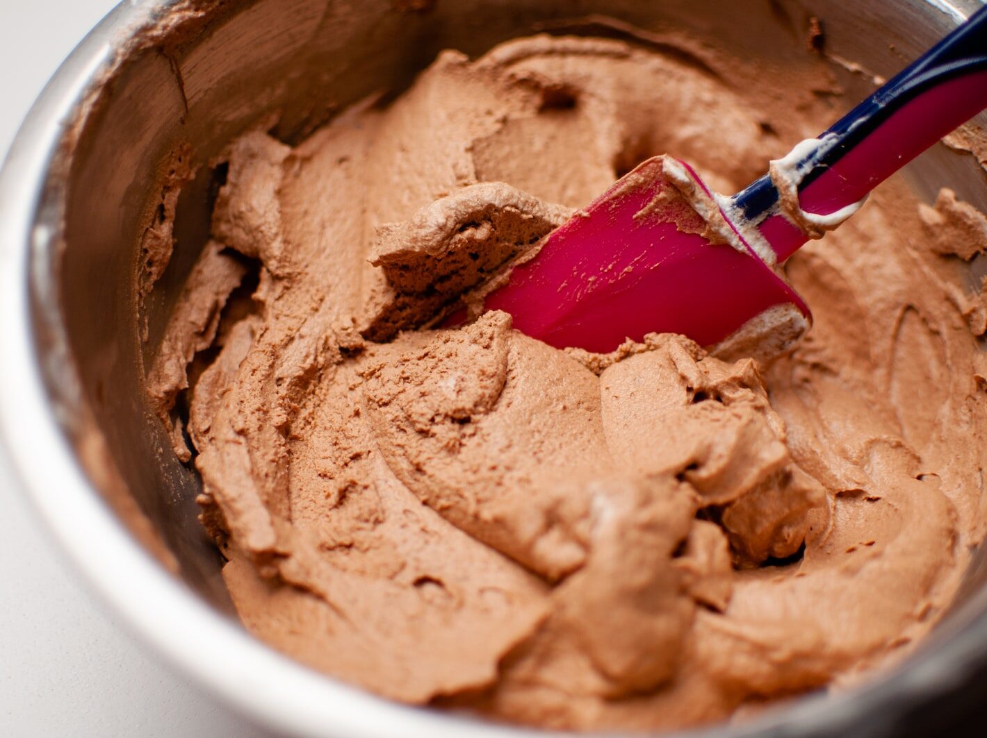 red handle silver fork on white ceramic bowl