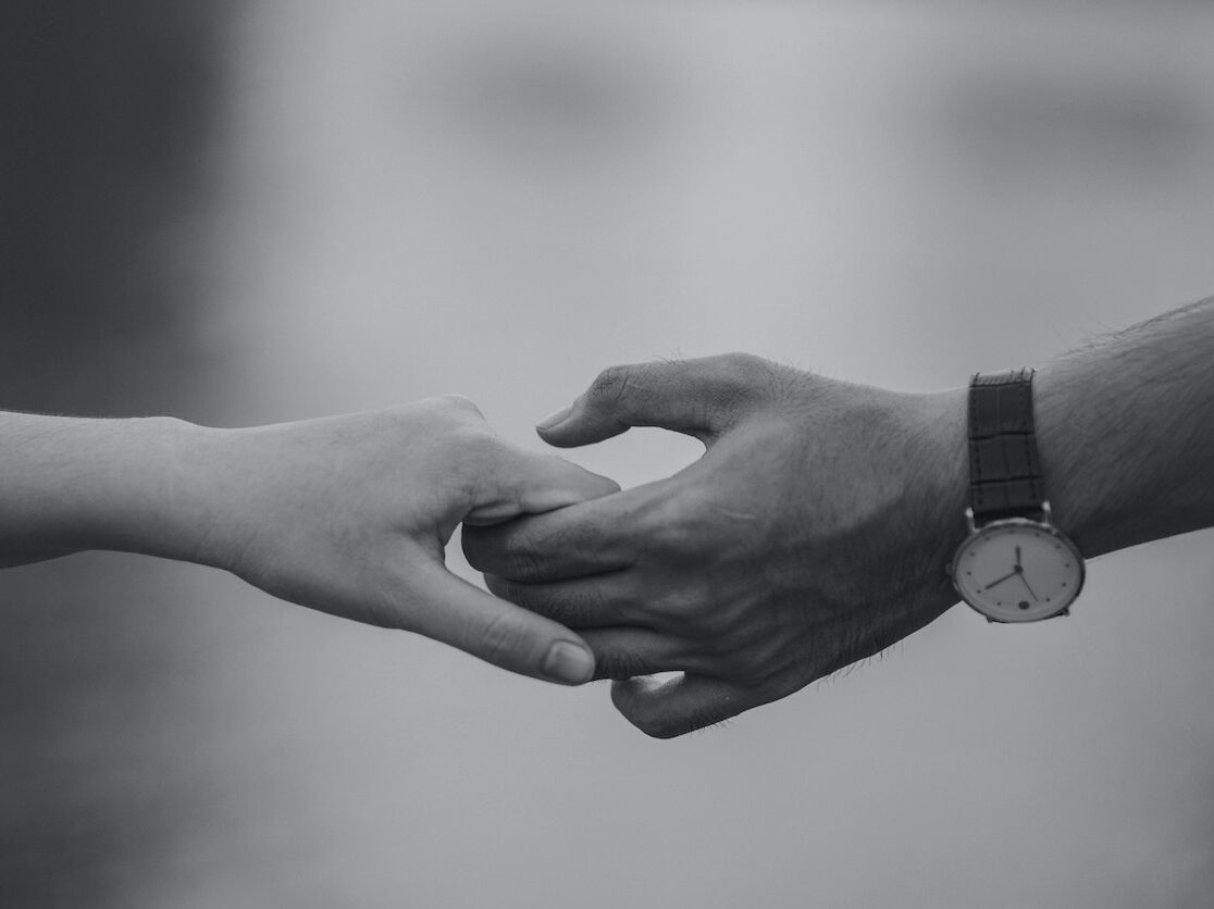 Monochrome Photo of Couple Holding Hands