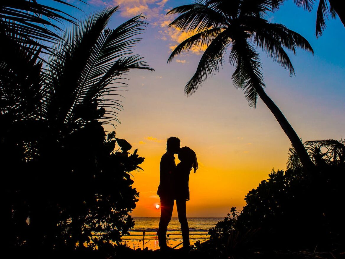 Silhouette of Man and Woman Kissing