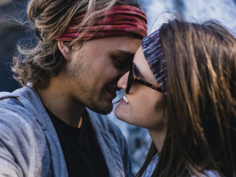 man and woman about to kiss each other