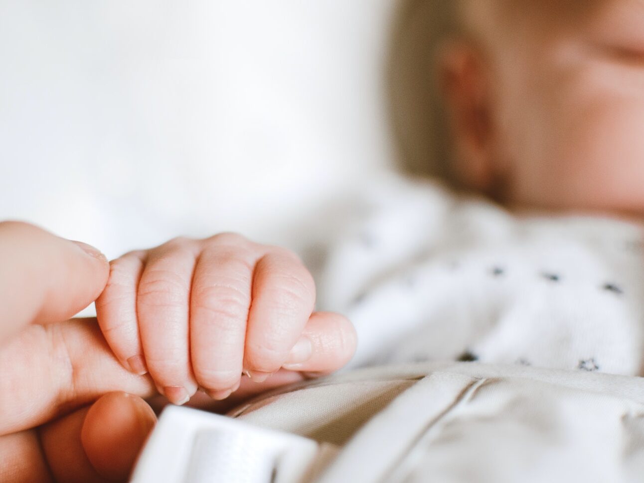 Person Holding Baby's Hand