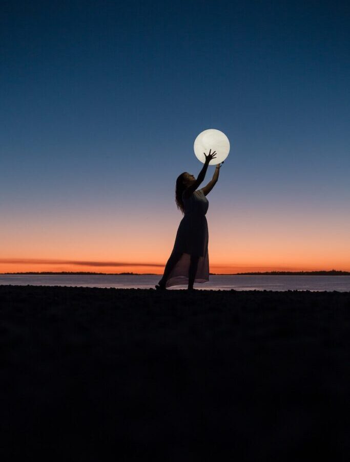 Woman Holding a Moon