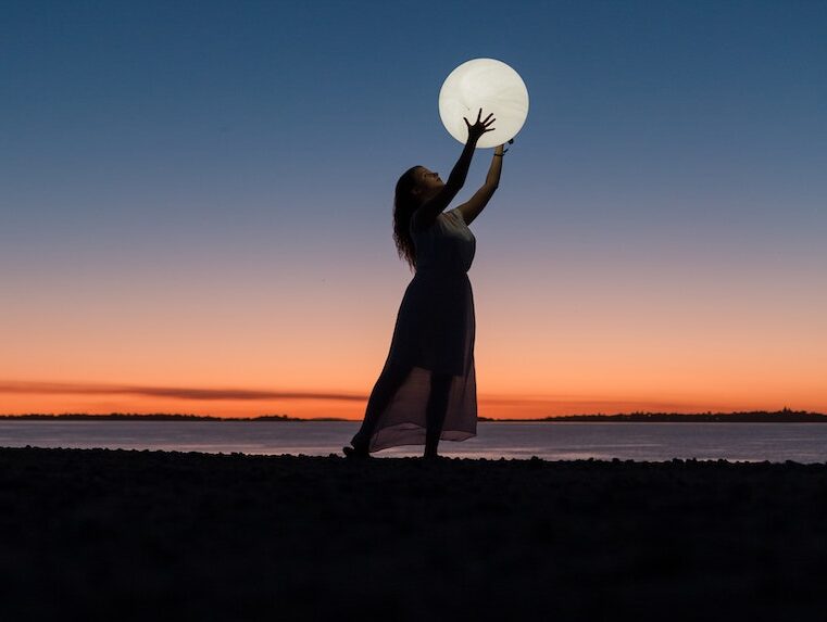 Woman Holding a Moon