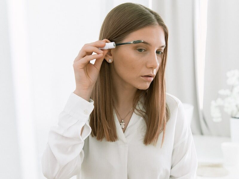 Photo Of Woman Applying Eyebrow Mascara