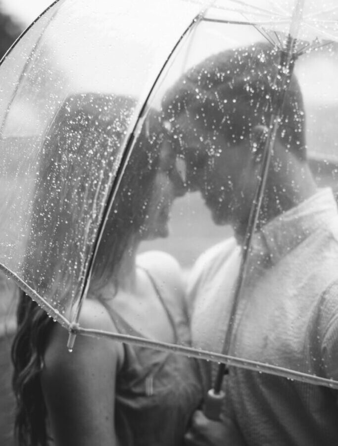 couple under clear umbrella