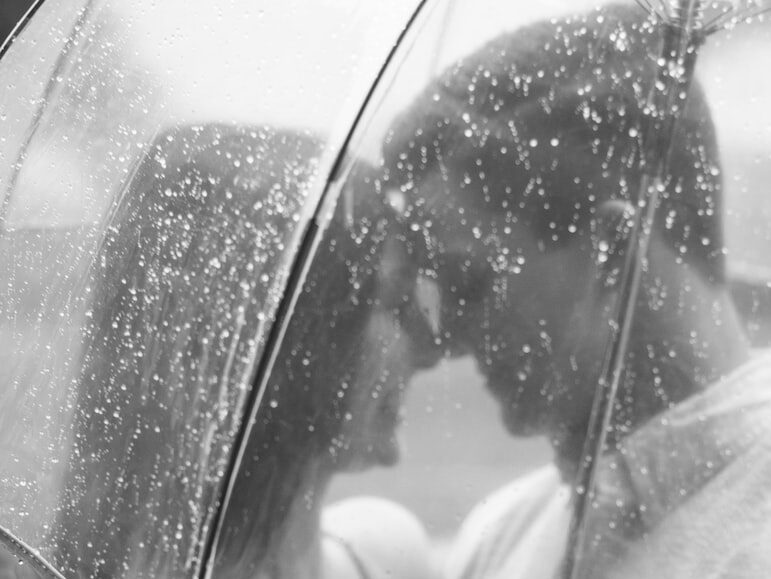 couple under clear umbrella