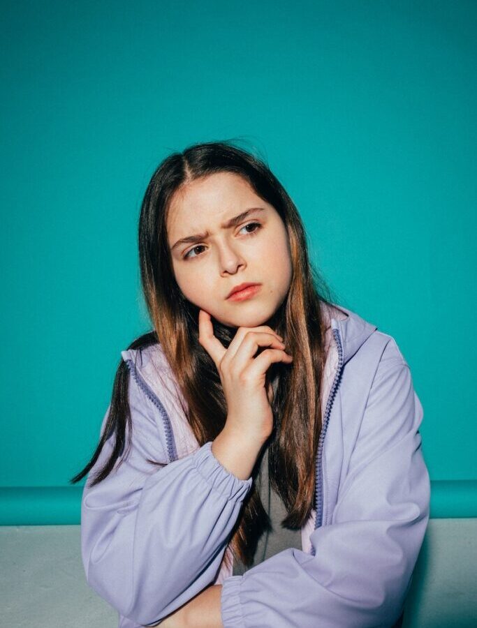 Girl Wearing a Jacket Thinking