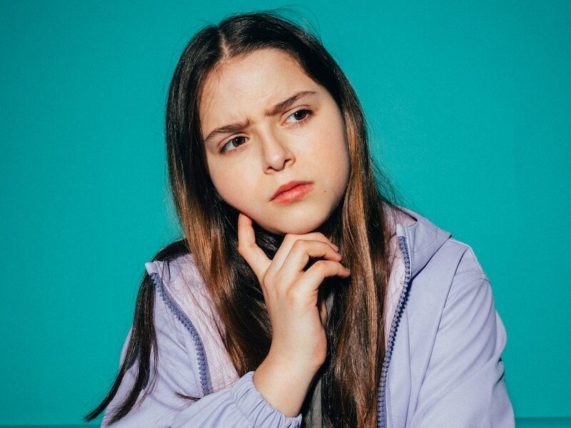 Girl Wearing a Jacket Thinking