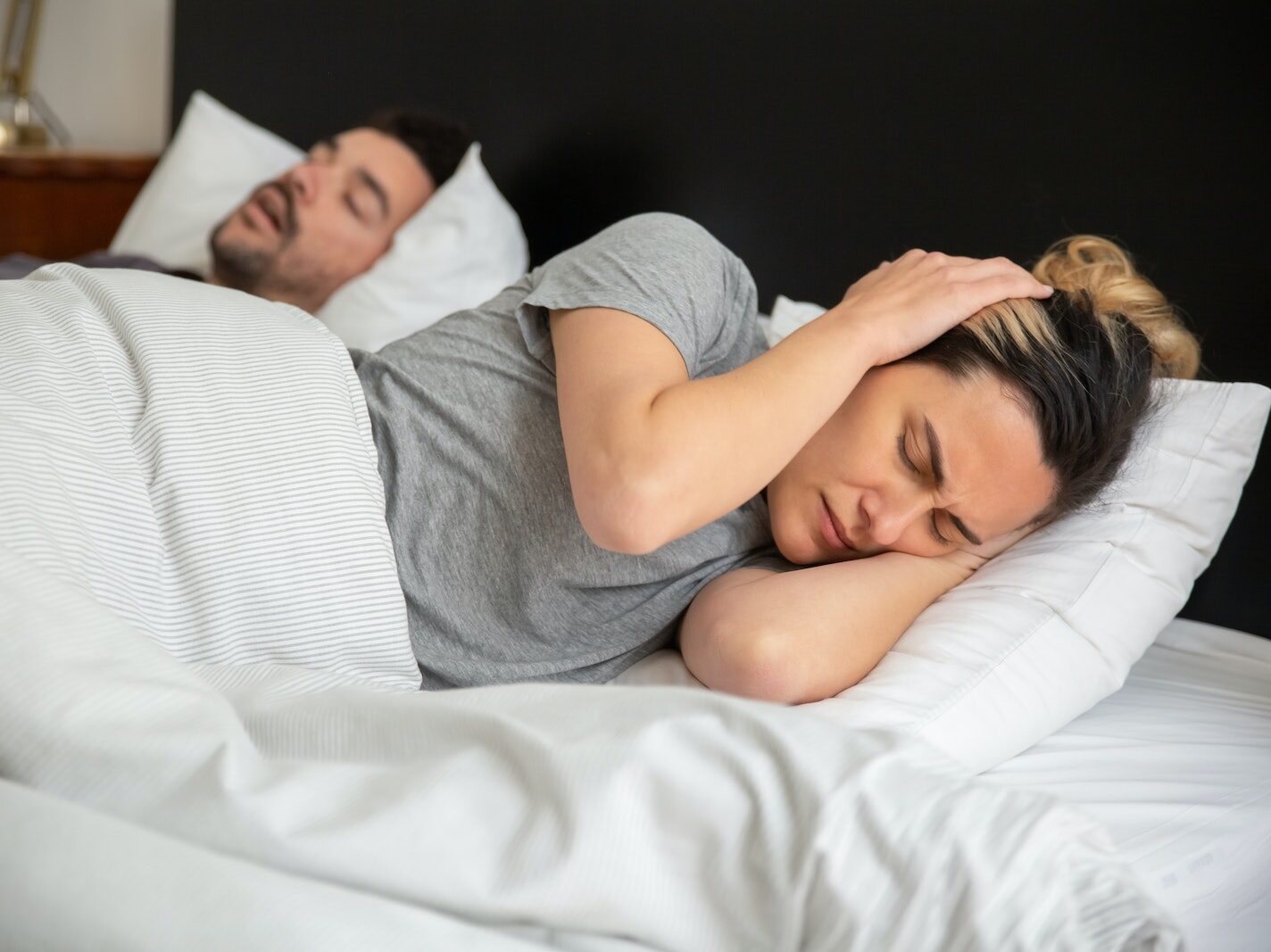 A Frustrated Woman Trying to Sleep