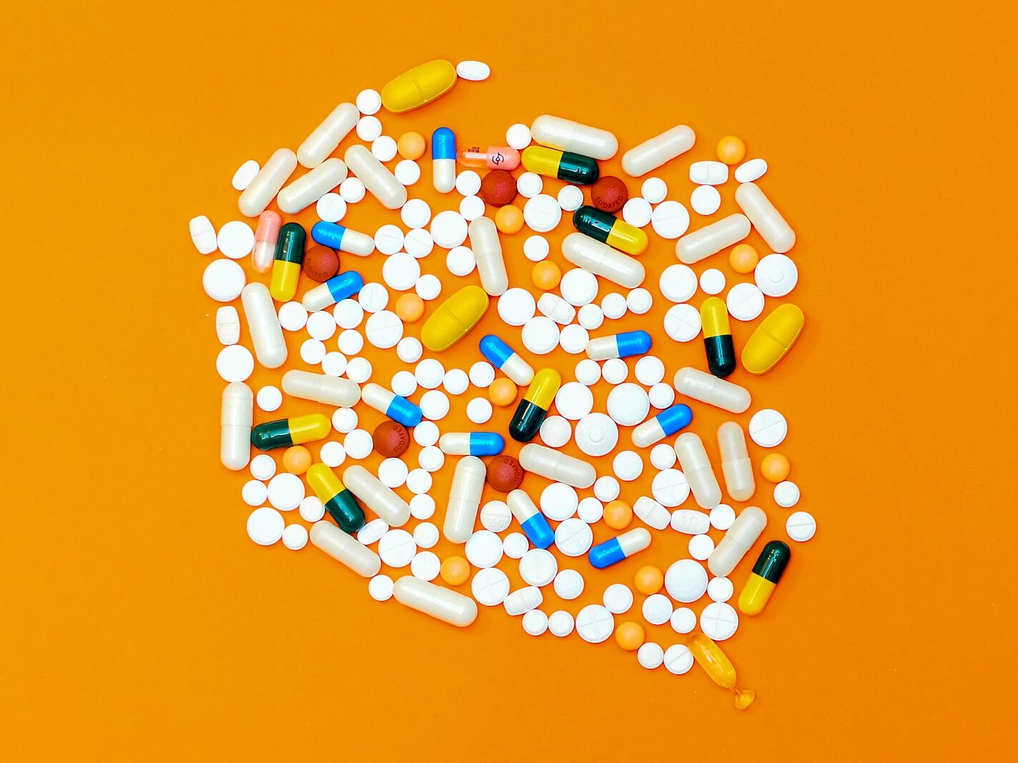 white and orange medication pill