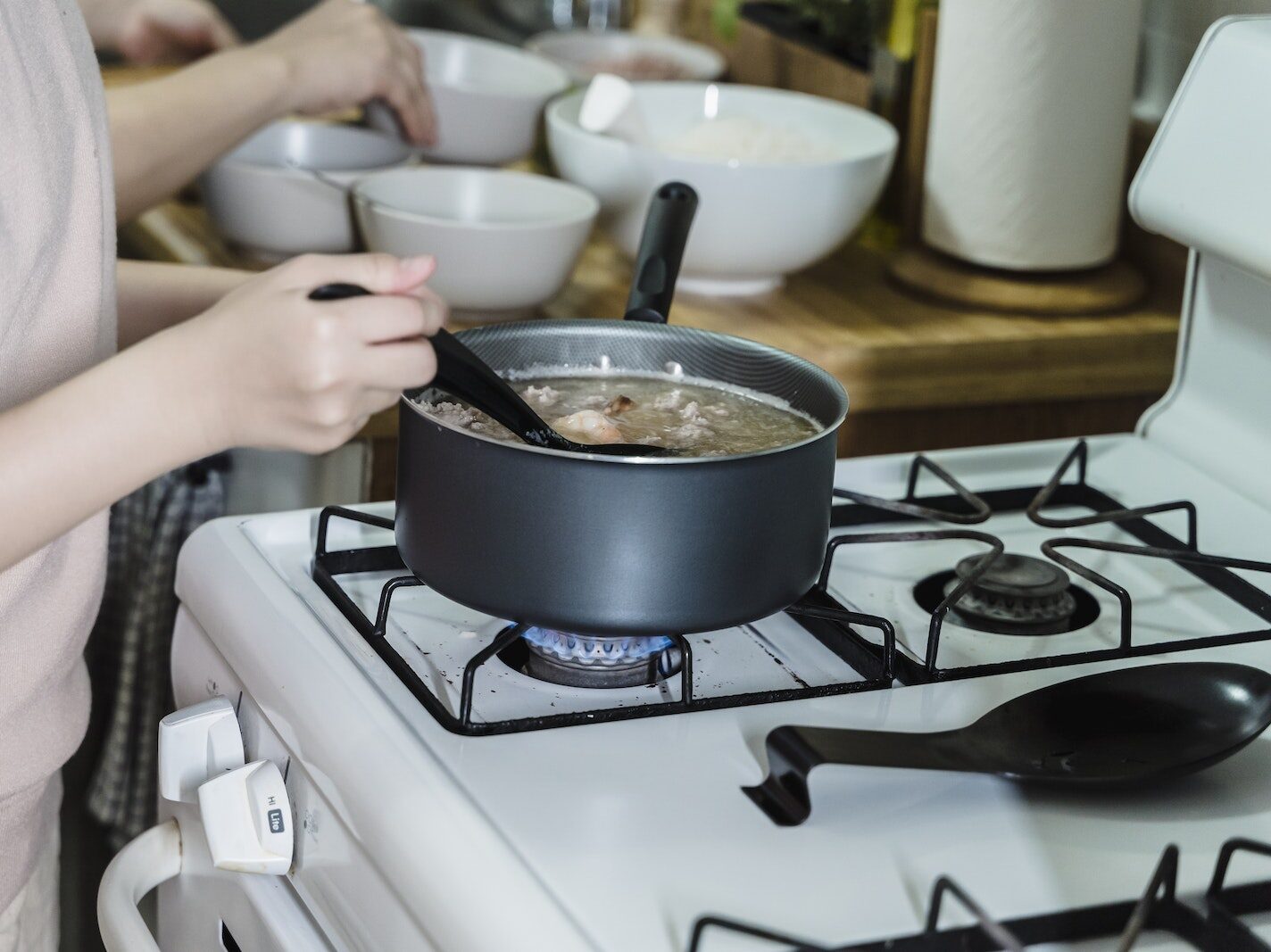Femal Hands Cooking in Pot