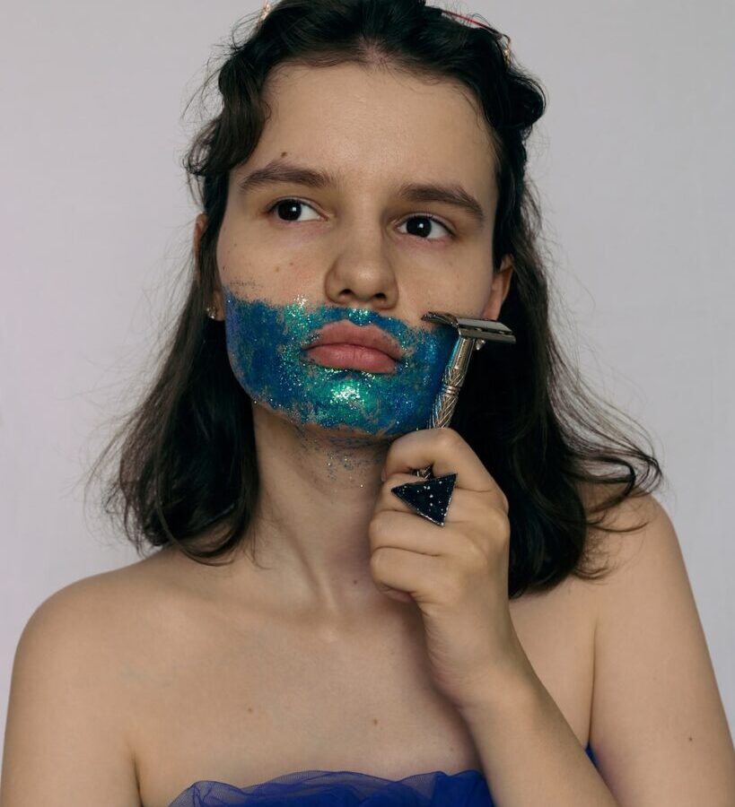 woman with blue and green paint on her face