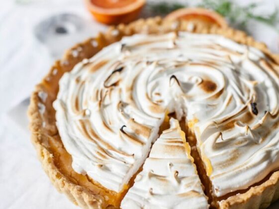 round sliced pie with cream