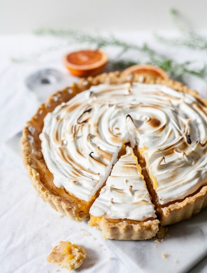 round sliced pie with cream